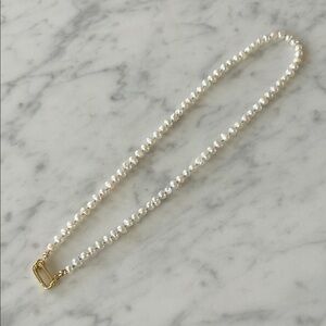 Hand knotted freshwater pearls on a carabiner clasp